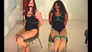 Two Women in Leotards Tied in Chairs