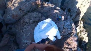 Couple fucking atop a cliff
