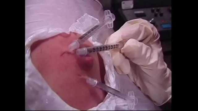 A naughty brunette and a busty redhead bitches wrapped a guy's body with a film and injected him with syringes