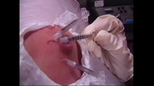 A naughty brunette and a busty redhead bitches wrapped a guy's body with a film and injected him with syringes